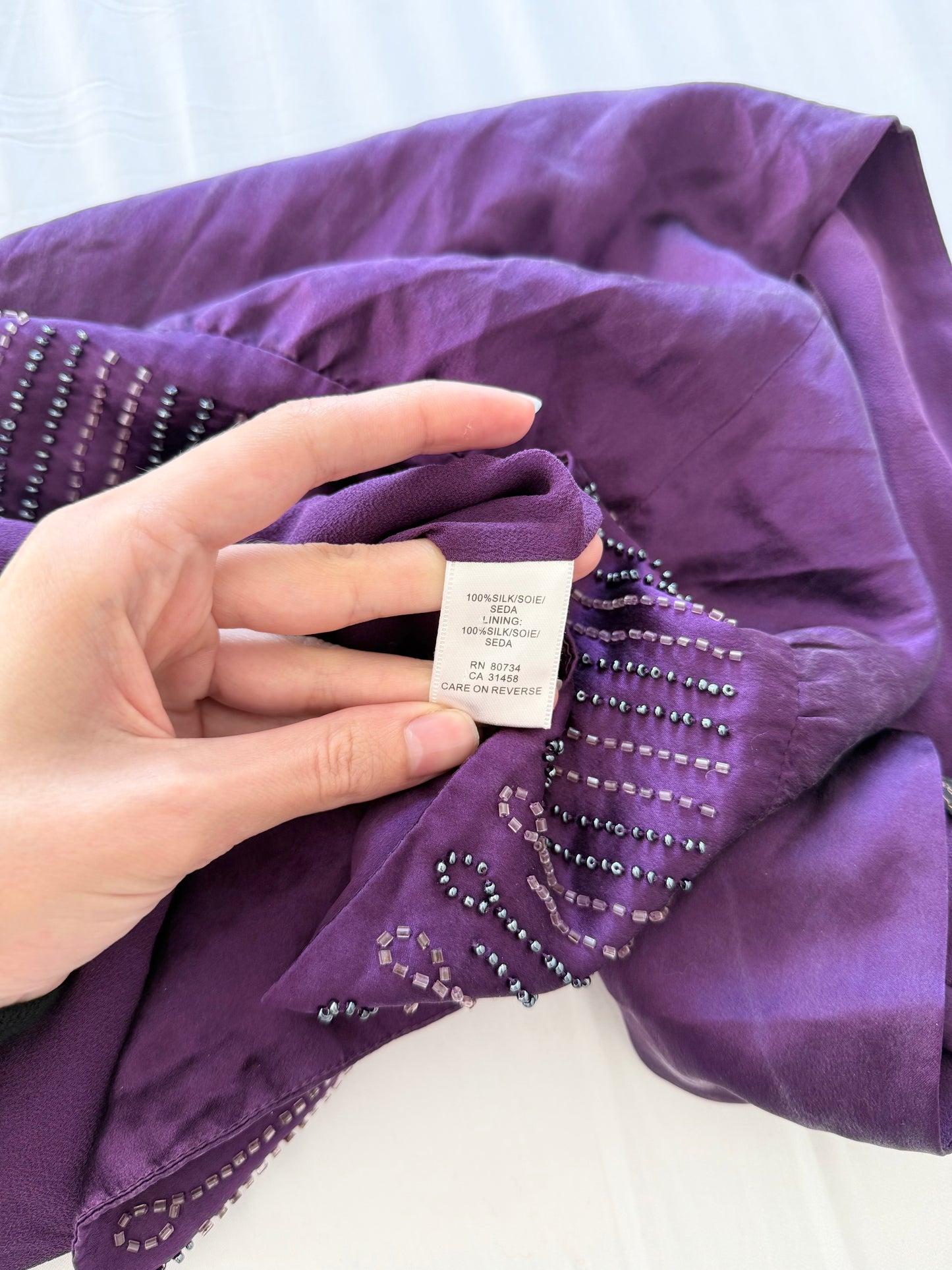 BCBG purple beaded 100% silk boho blouse.