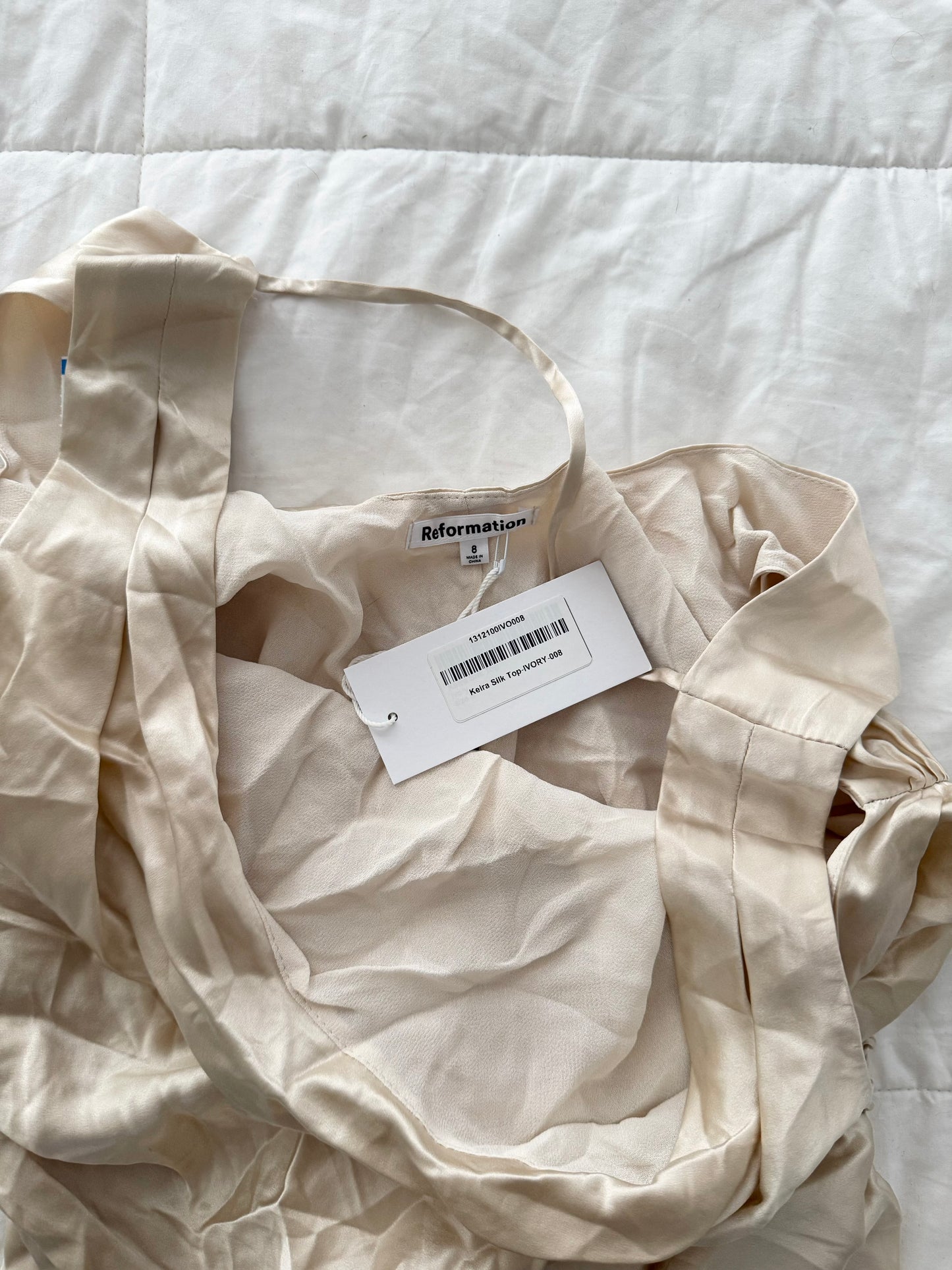 Reformation champagne 100% silk cowl neck blouse.